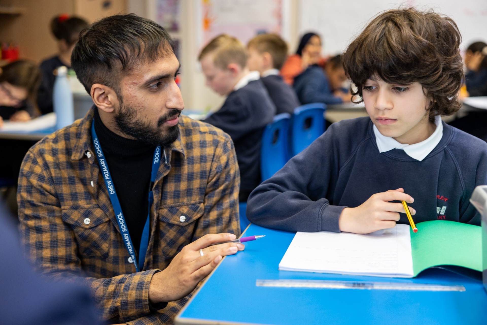 teacher with child in classroom