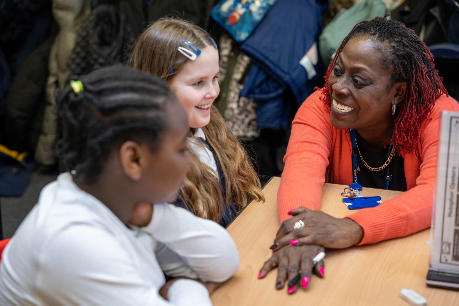 Trainee Teacher talking to two children